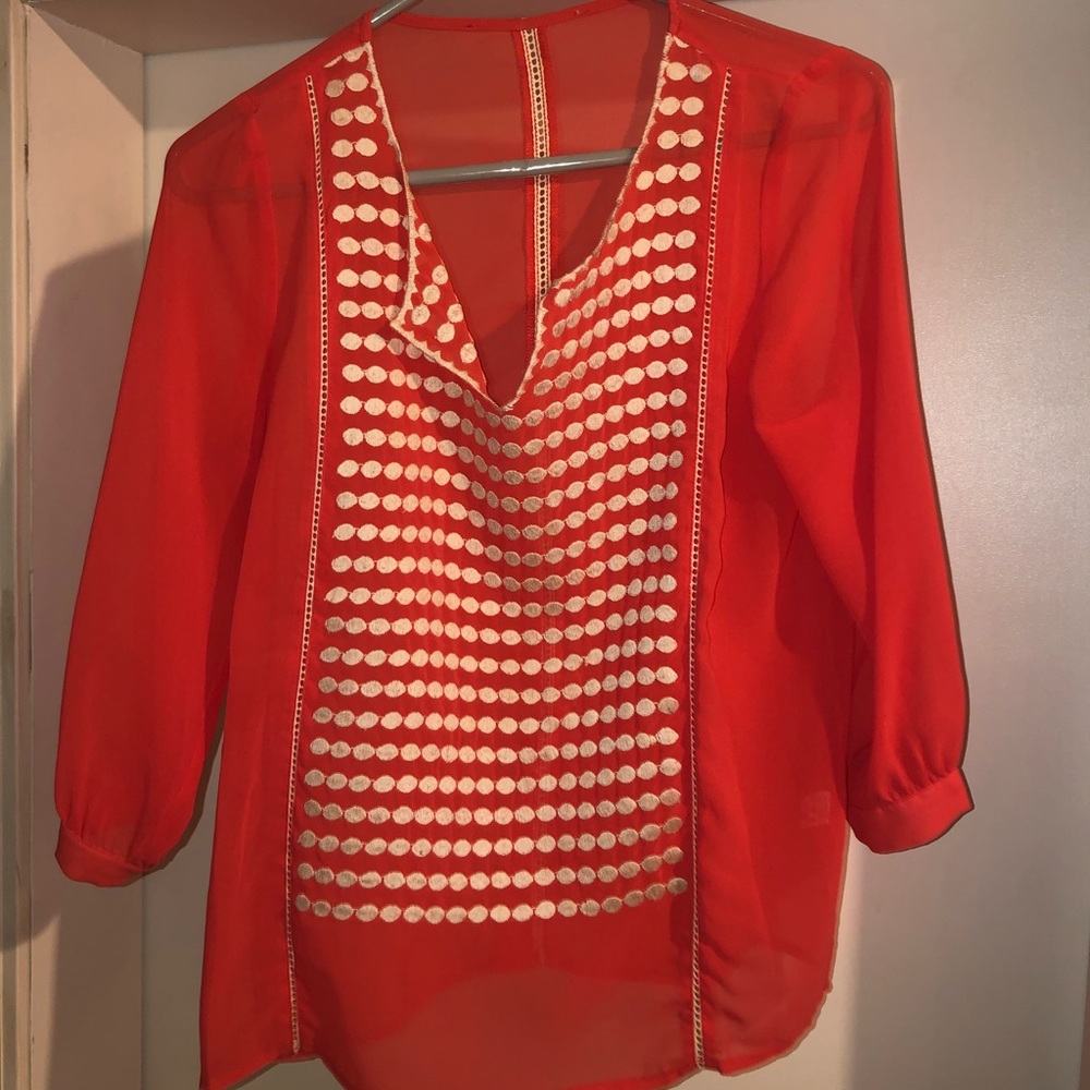 Pink blouse with white polka dot detail